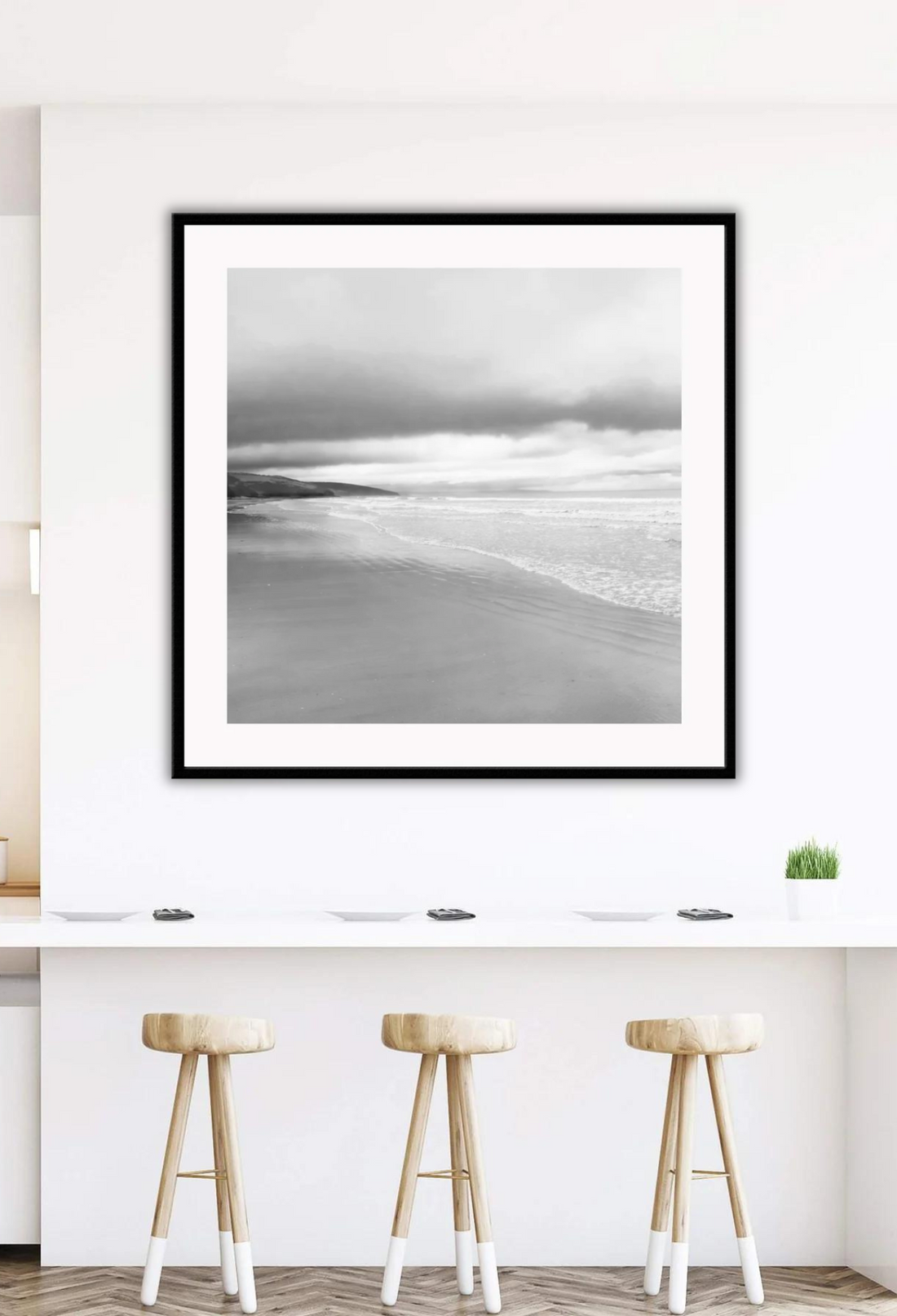 Black and white photograph of a beach scene with framed print boundaries.