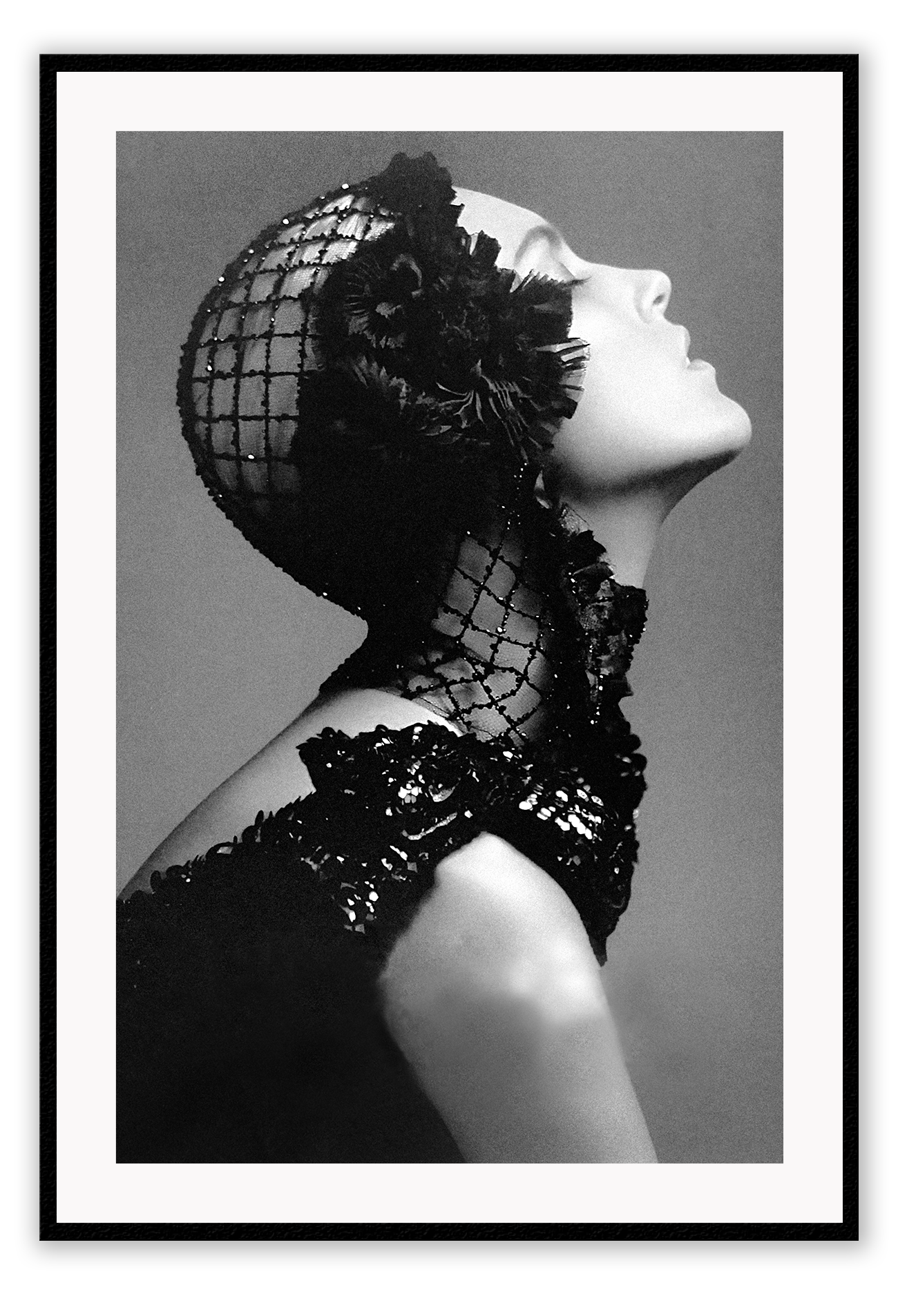 A black and white, vintage fashion wall art with Coco chanel woman wearing black lace flower. 
