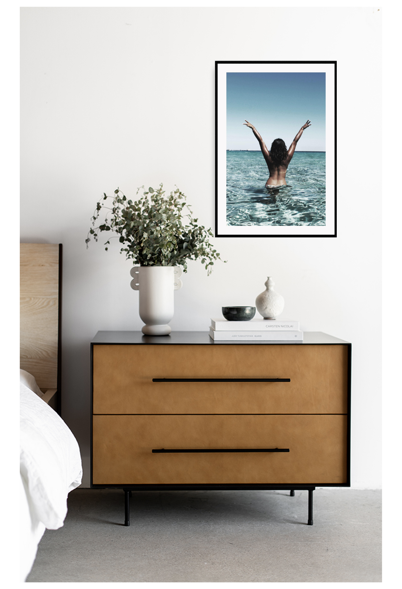 Photography fashion woman tan in water nude sexy back facing camera freedom beach. Art placed on white wall above set of drawers