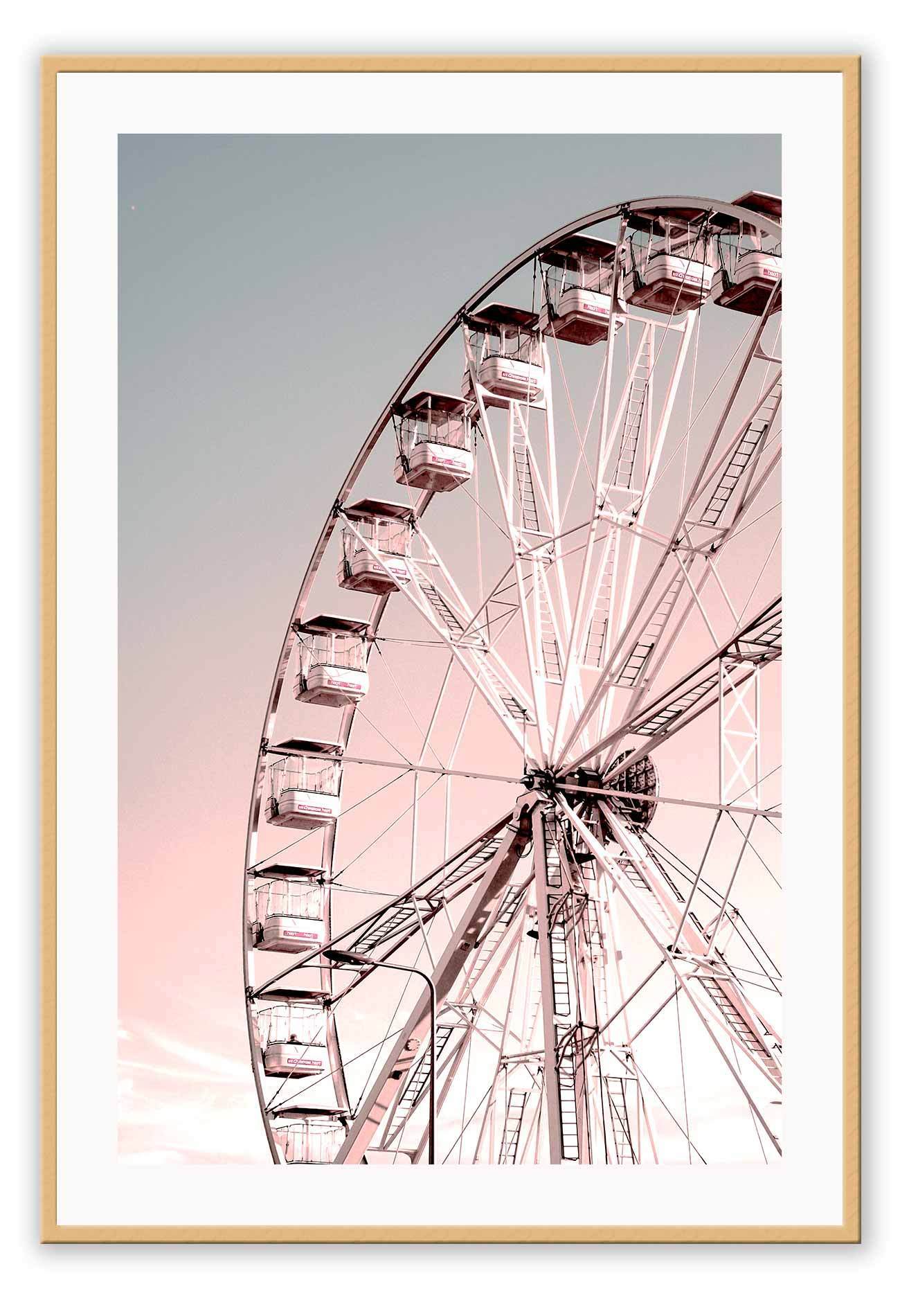 A nursery wall art with ferris wheel in pink and blue sky. 