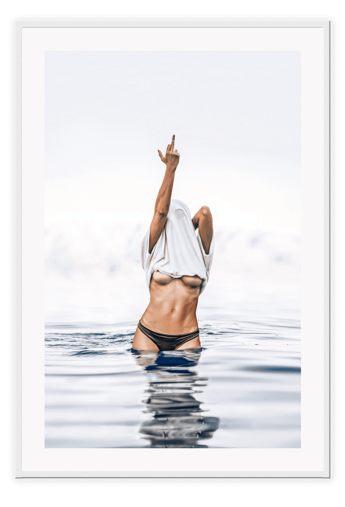 Person in black bikini with white towel over head in water