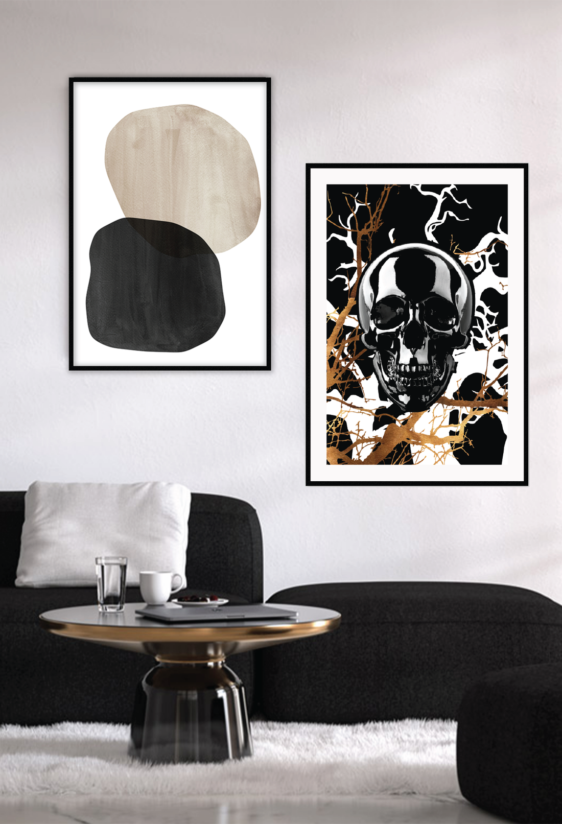 A framed art print featuring a stylized, black skull with gold and black branches in the background, set in a matte black frame. Hung on a white wall above a black lounge.