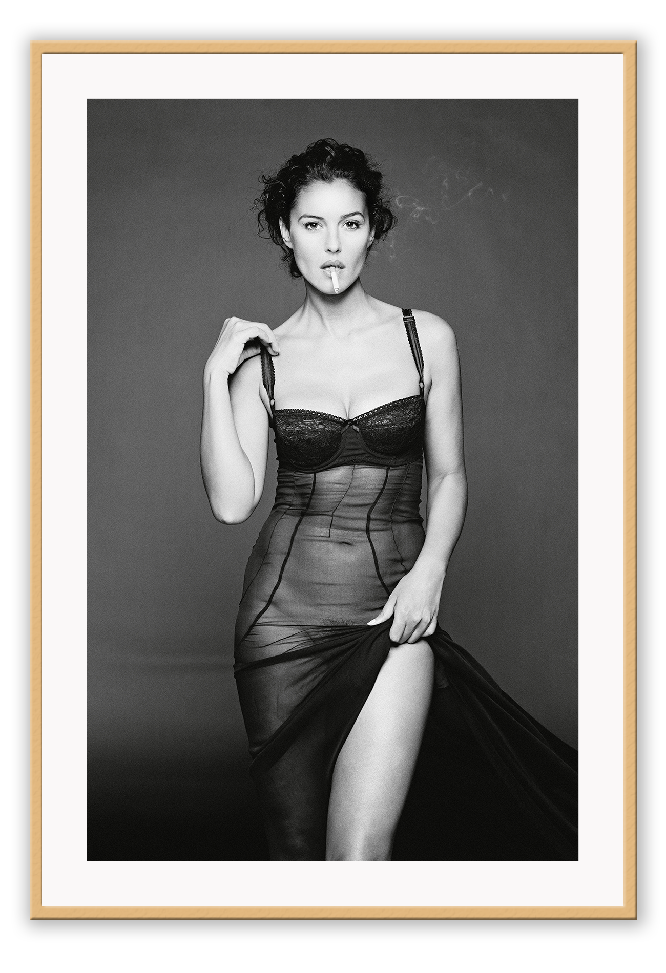 This image features a striking black and white photograph of Monica Bellucci, captured in a portrait orientation. Displayed in a high-quality, custom-made matte wood frame, the print is mounted on perspex glass that enhances its clarity and finish.