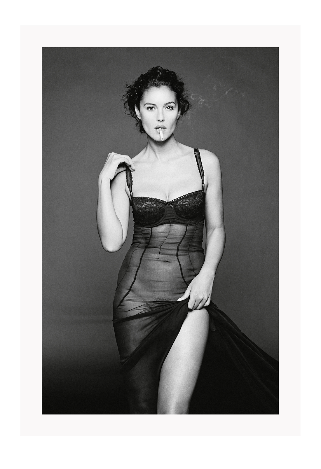 This image features a striking black and white photograph of Monica Bellucci, captured in a portrait orientation. Displayed in a high-quality, custom-made matte wood frame, the print is mounted on perspex glass that enhances its clarity and finish.