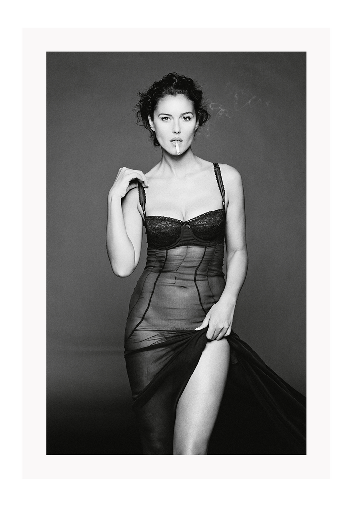 This image features a striking black and white photograph of Monica Bellucci, captured in a portrait orientation. Displayed in a high-quality, custom-made matte wood frame, the print is mounted on perspex glass that enhances its clarity and finish.
