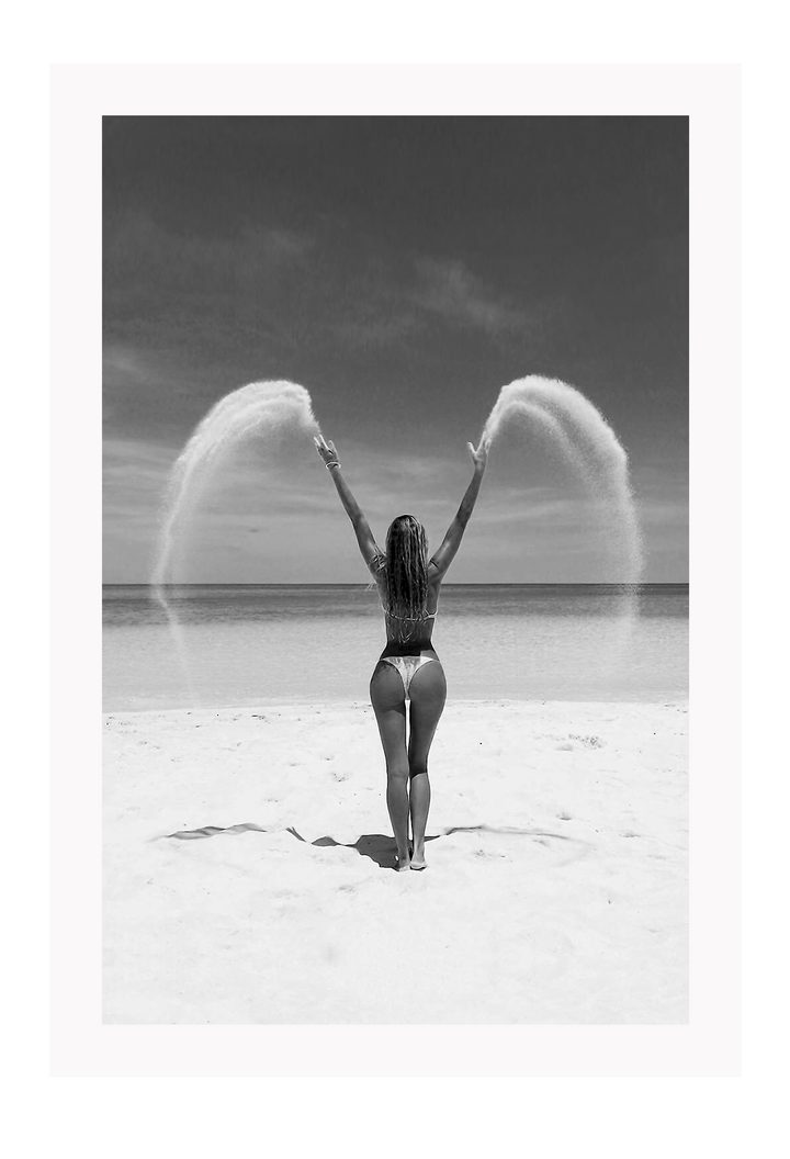 Sexy lady woman throwing sand on a beach in black and white, coastal ocean. 