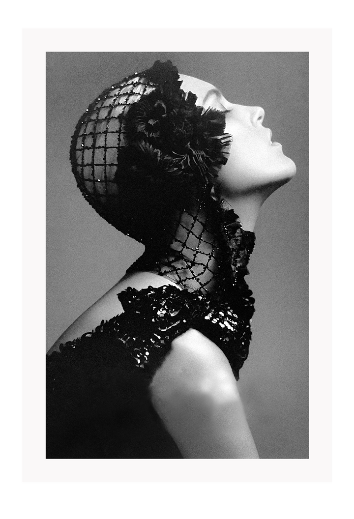 A black and white, vintage fashion wall art with Coco chanel woman wearing black lace flower. 