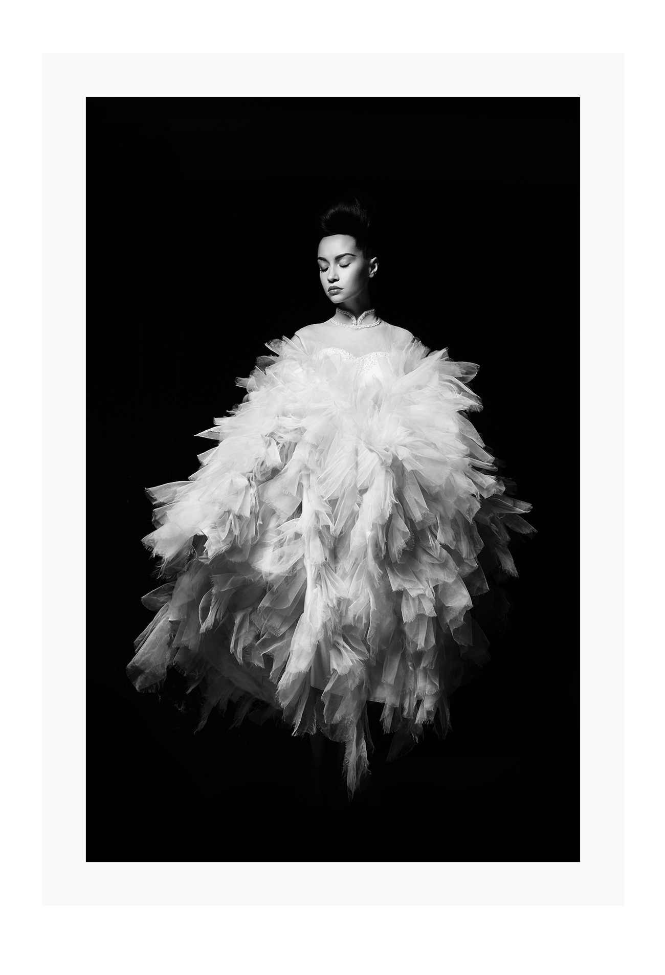 Fashion print with woman in white dress floating on a black background  