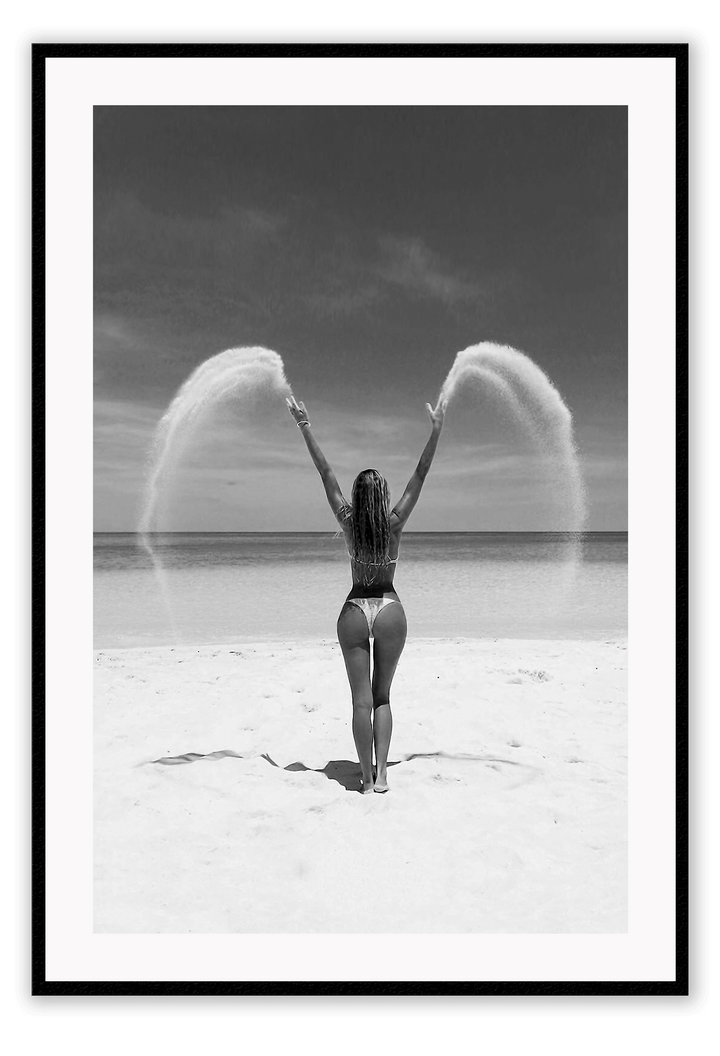 Sexy lady woman throwing sand on a beach in black and white, coastal ocean. 