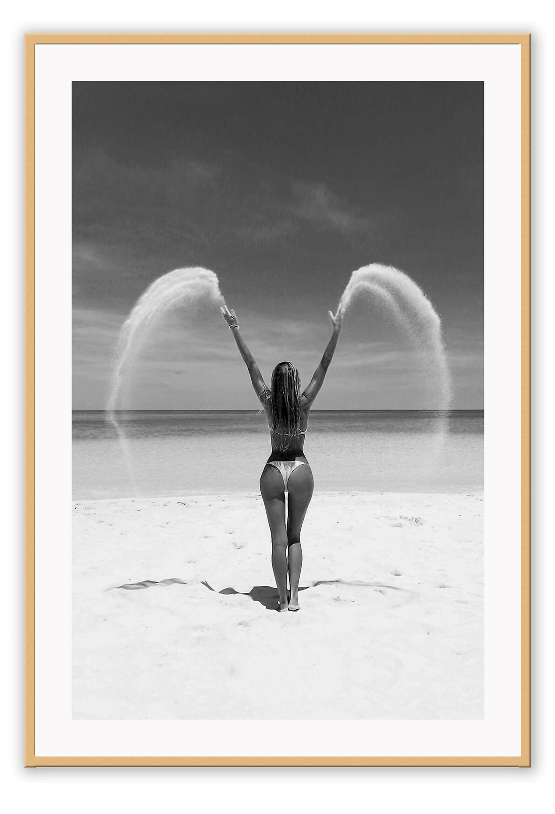 Sexy lady woman throwing sand on a beach in black and white, coastal ocean. 