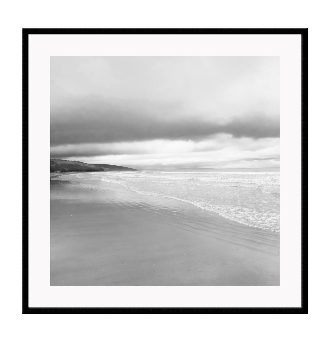 Black and white photograph of a beach scene with framed print boundaries.