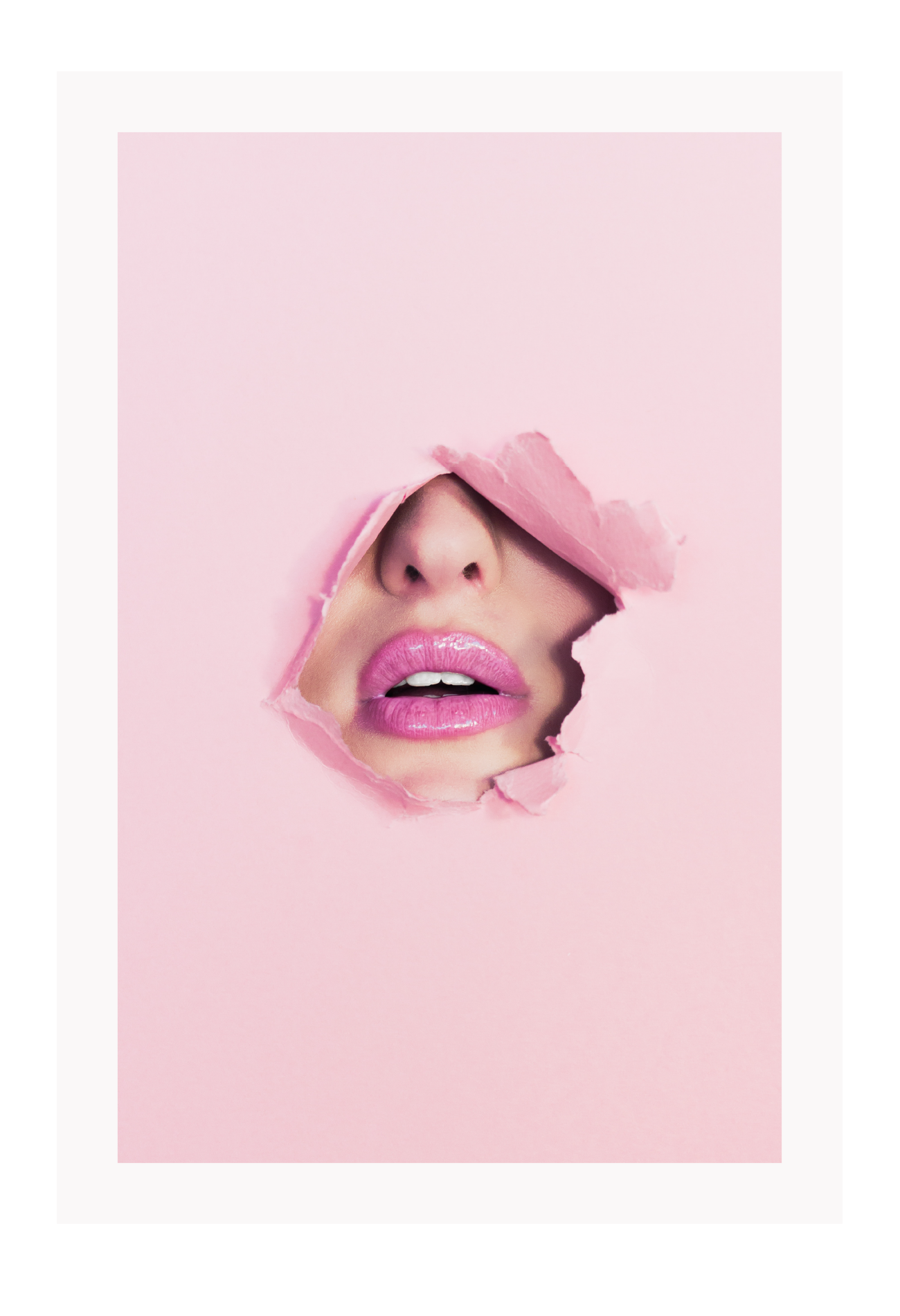 A pink wall art with fashion model face and pink lips. 