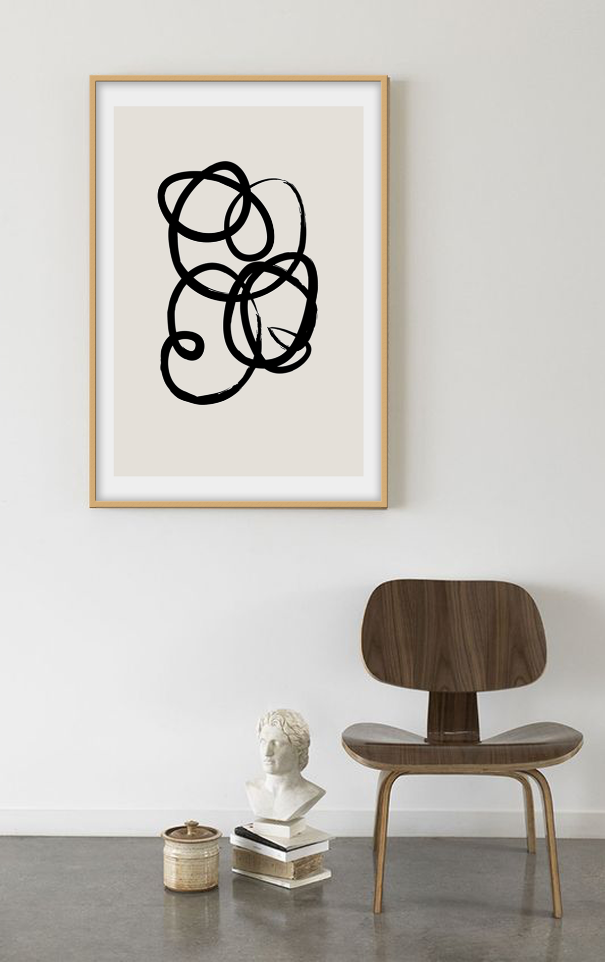 Abstract black and white squiggle print with textured black line and cream background 