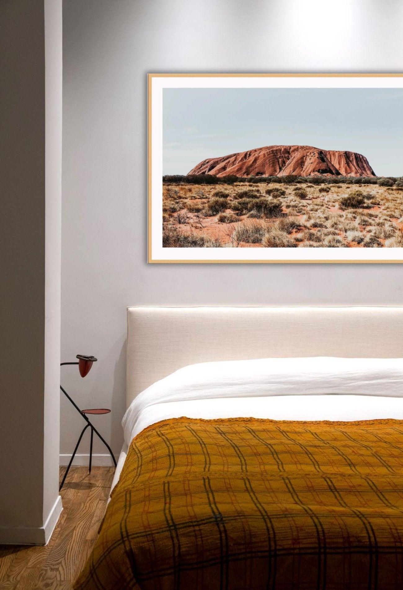 Stunning visual photo of Uluru and grassland with blue sky