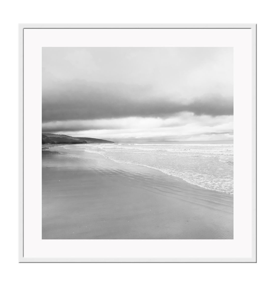 Black and white photograph of a beach scene with framed print boundaries.